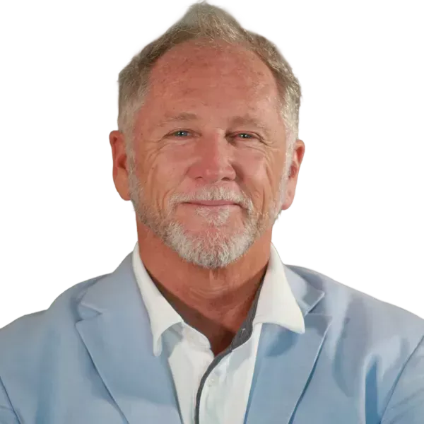 Headshot of a man with white goatee wearing a light blue blazer and white shirt
